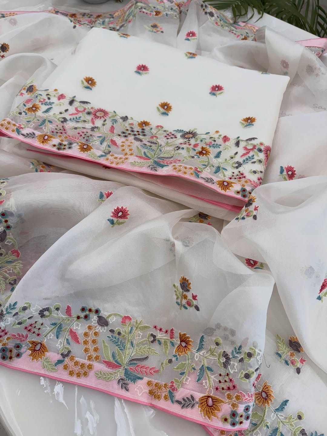 Pure organza silk thread work embroidered kurta and dupatta combined with a plain lower.