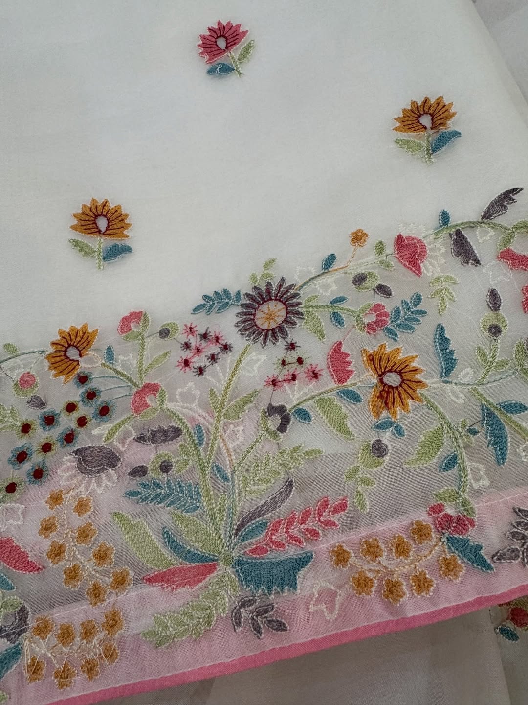 Pure organza silk thread work embroidered kurta and dupatta combined with a plain lower.