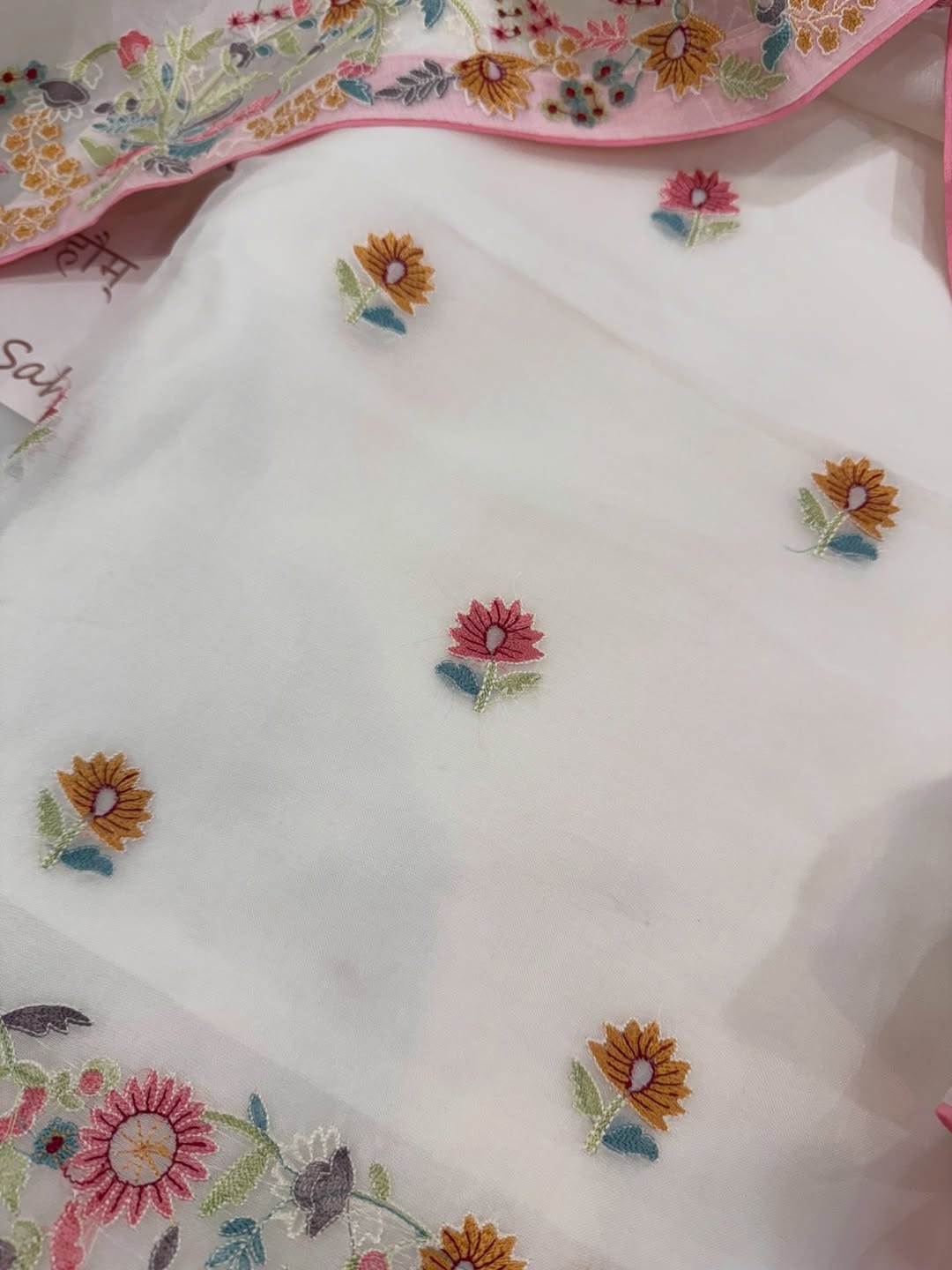 Pure organza silk thread work embroidered kurta and dupatta combined with a plain lower.