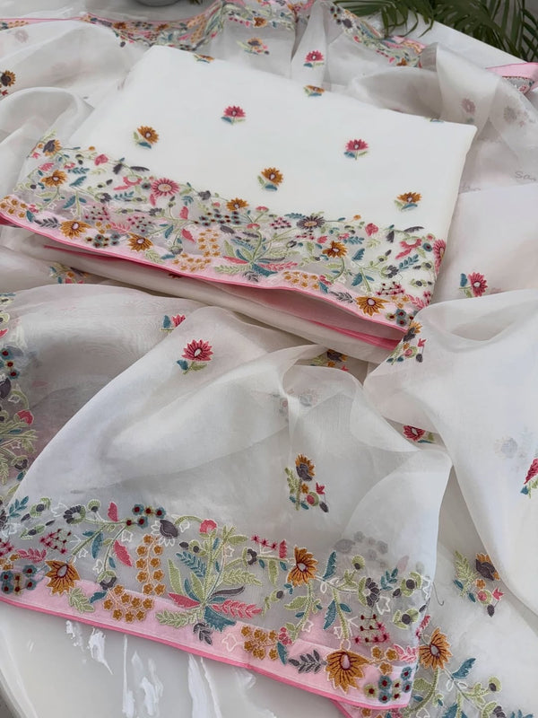 Pure organza silk thread work embroidered kurta and dupatta combined with a plain lower.