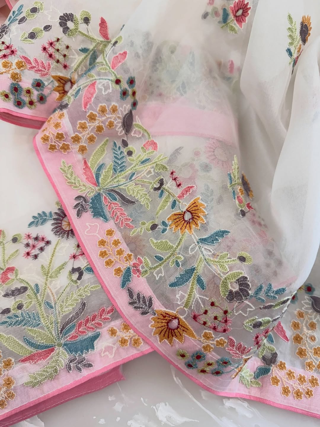 Pure organza silk thread work embroidered kurta and dupatta combined with a plain lower.