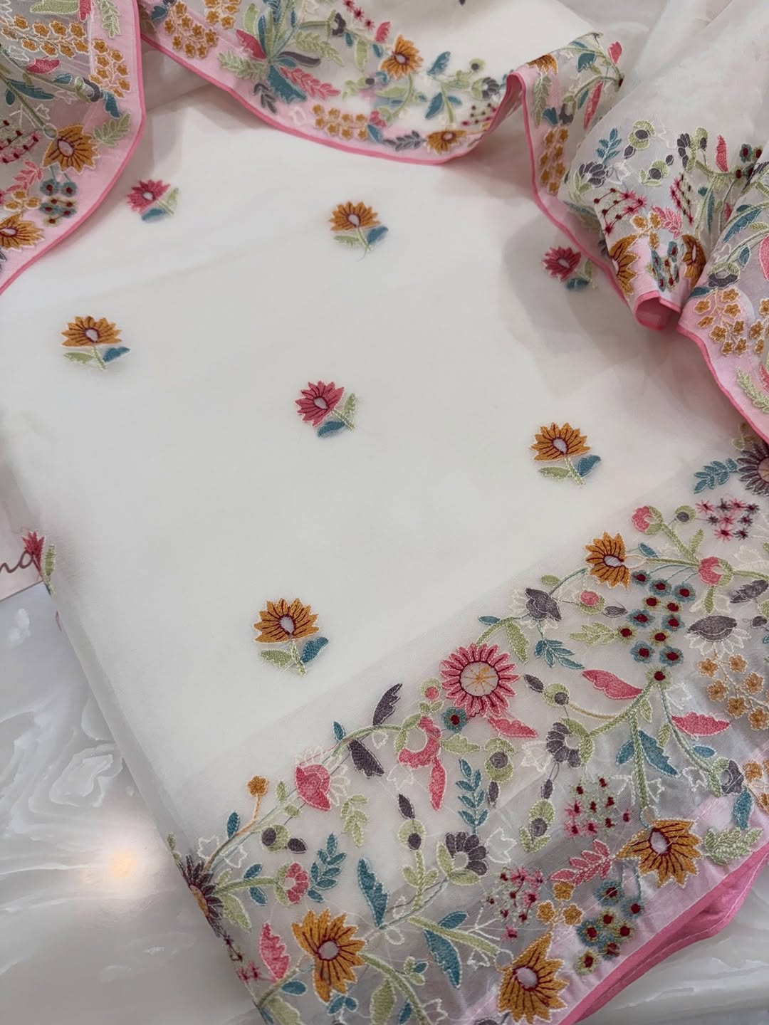 Pure organza silk thread work embroidered kurta and dupatta combined with a plain lower.