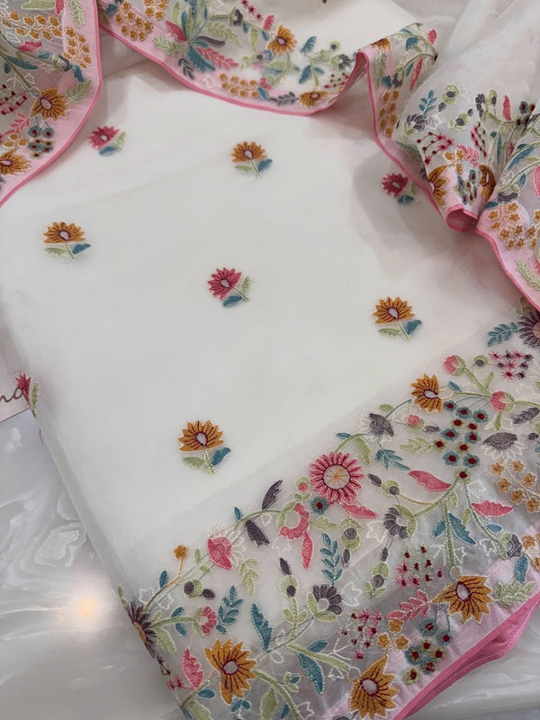 Pure organza silk thread work embroidered kurta and dupatta combined with a plain lower.