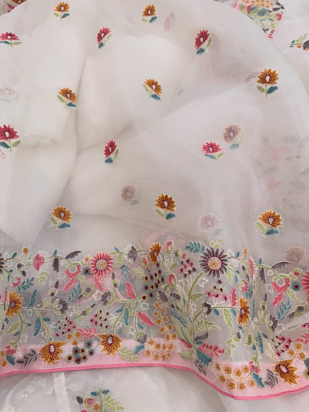 Pure organza silk thread work embroidered kurta and dupatta combined with a plain lower.