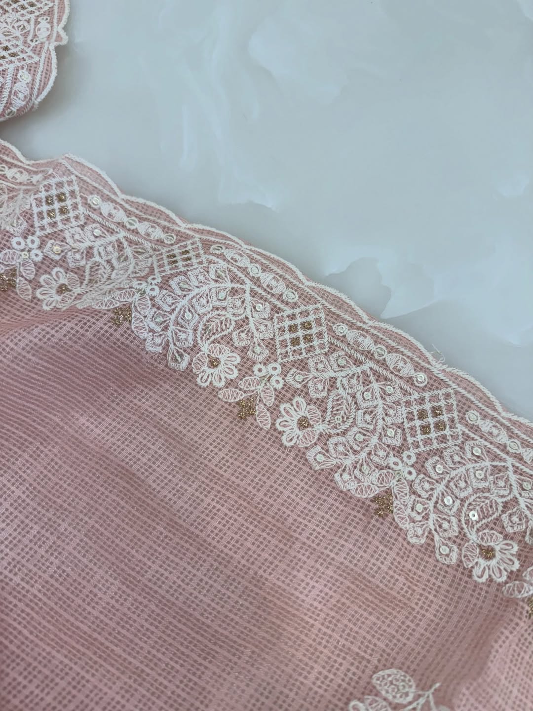 kota doria thread work embroidered kurta and dupatta combined with a plain lower.